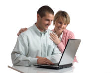 Man and Woman Looking at Laptop